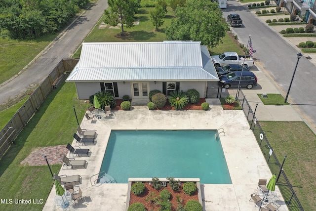 view of swimming pool featuring a patio area