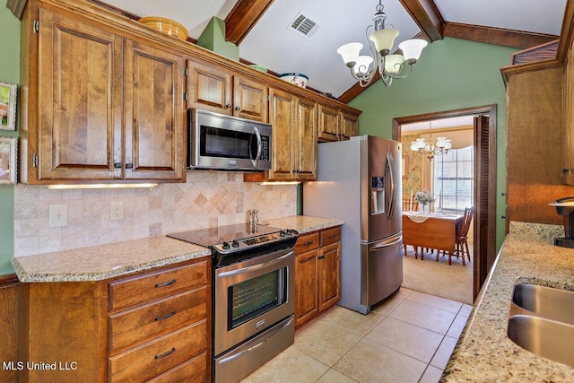 kitchen with visible vents, lofted ceiling with beams, decorative backsplash, an inviting chandelier, and appliances with stainless steel finishes