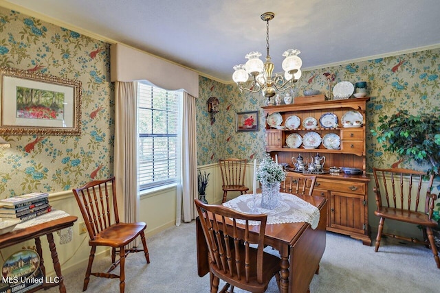 dining area with carpet floors, baseboards, ornamental molding, wallpapered walls, and an inviting chandelier