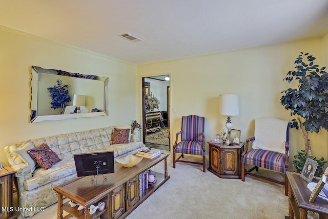 carpeted living room with visible vents and crown molding