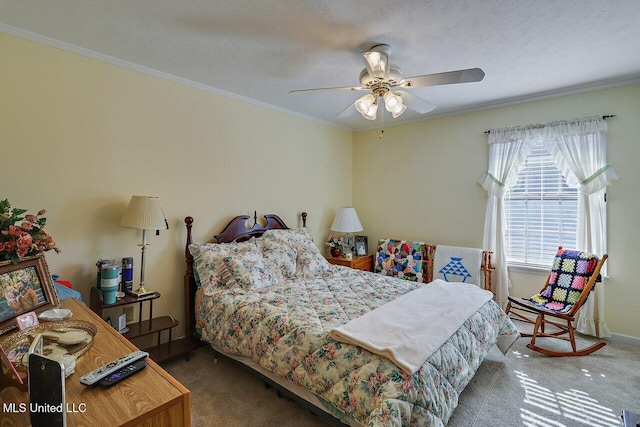 carpeted bedroom featuring ornamental molding, a textured ceiling, and a ceiling fan