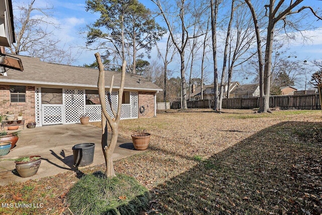 view of yard with a patio area and fence