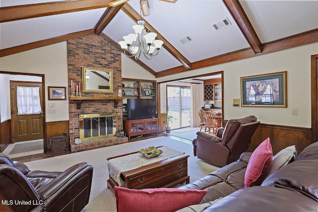 living area with wood walls, wainscoting, visible vents, and a brick fireplace