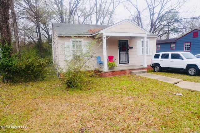 bungalow with a front yard