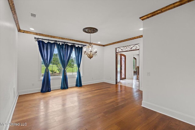 12025 Springridge Rd, Terry, MS 39170 - empty room featuring a chandelier, crown molding, wood finished floors, recessed lighting, and arched walkways