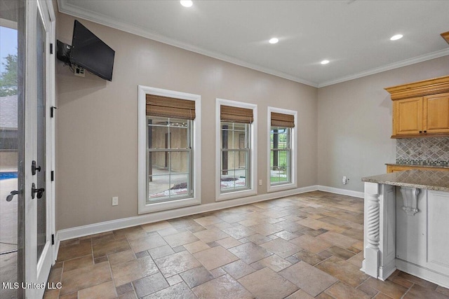 12025 Springridge Rd, Terry, MS 39170 - kitchen with backsplash, crown molding, light stone countertops, recessed lighting, and stone tile flooring
