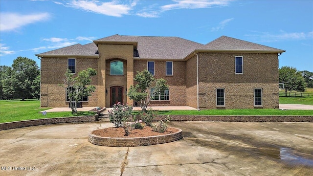 12025 Springridge Rd, Terry, MS 39170 - view of front of home with a front lawn, brick siding, and a patio