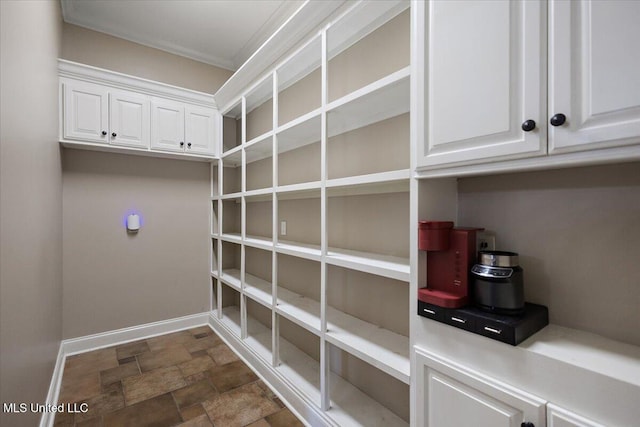 12025 Springridge Rd, Terry, MS 39170 - washroom with stone finish floors and crown molding