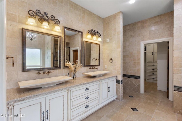 12025 Springridge Rd, Terry, MS 39170 - bathroom with tile walls, double vanity, tile patterned floors, and decorative backsplash