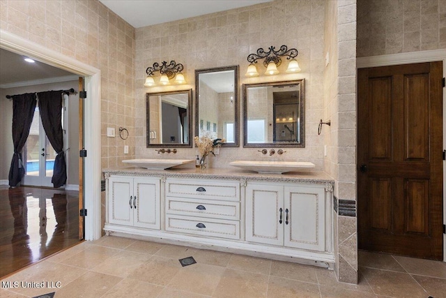 12025 Springridge Rd, Terry, MS 39170 - full bath with double vanity, tile walls, and tile patterned flooring