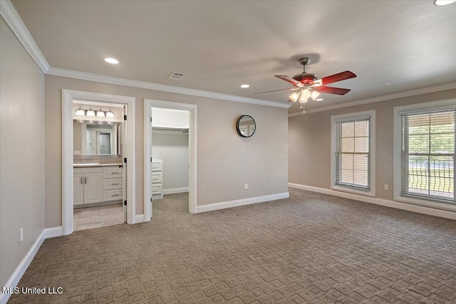 12025 Springridge Rd, Terry, MS 39170 - unfurnished bedroom featuring light colored carpet, crown molding, recessed lighting, ensuite bath, and a walk in closet