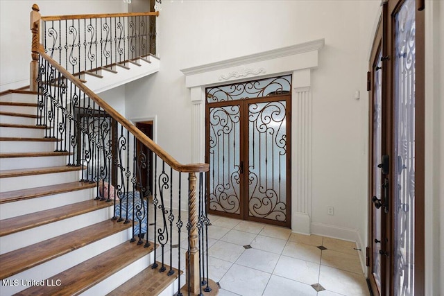12025 Springridge Rd, Terry, MS 39170 - foyer with french doors, stairs, and tile patterned flooring