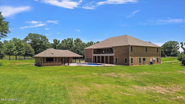 12025 Springridge Rd, Terry, MS 39170 - back of house with an outdoor pool, a patio, and a balcony