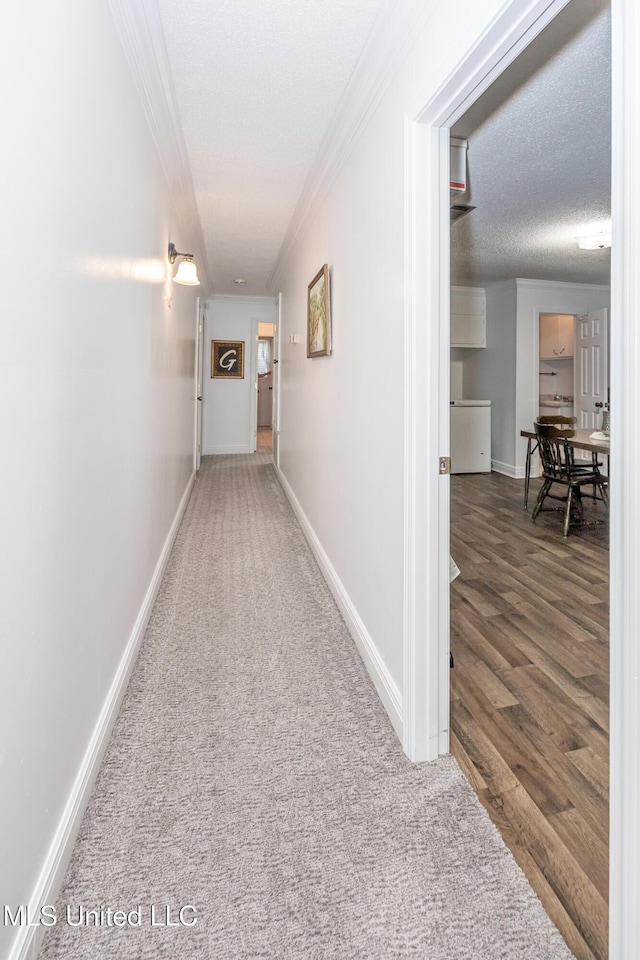 10001 Echo Glen Dr, Moss Point, MS 39562 - corridor featuring crown molding, carpet, and wood finished floors