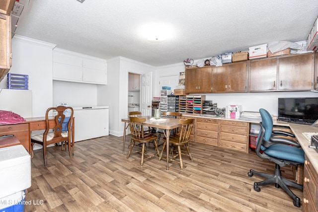 10001 Echo Glen Dr, Moss Point, MS 39562 - office space featuring light wood-style flooring, a textured ceiling, crown molding, and built in study area