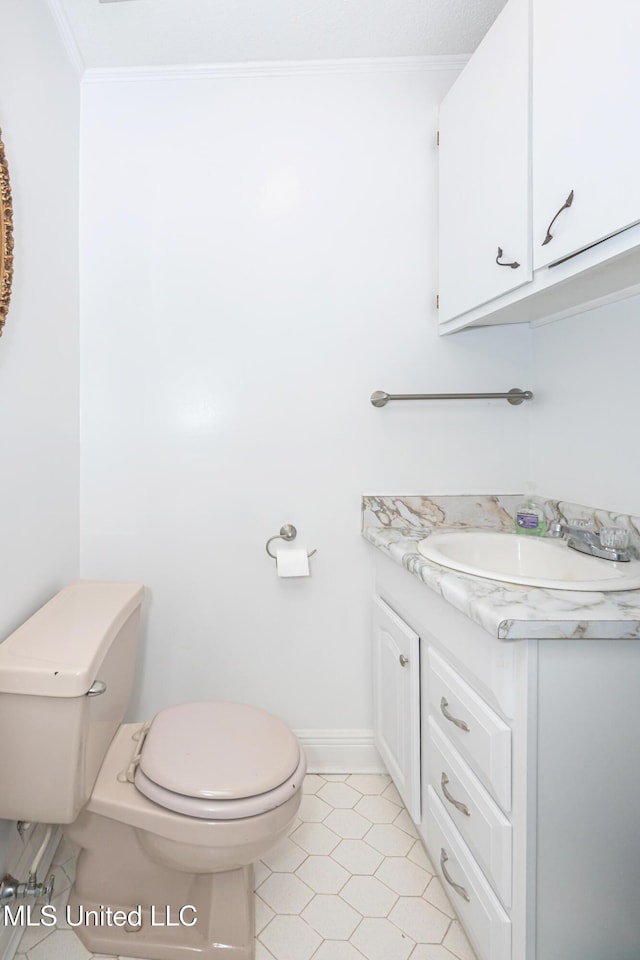 10001 Echo Glen Dr, Moss Point, MS 39562 - bathroom with vanity, ornamental molding, and tile patterned flooring