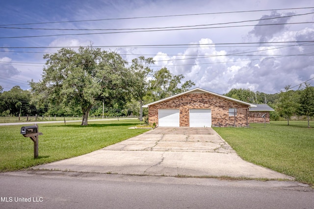 10001 Echo Glen Dr, Moss Point, MS 39562 - view of front facade featuring a front yard, concrete driveway, brick siding, and view of scattered trees