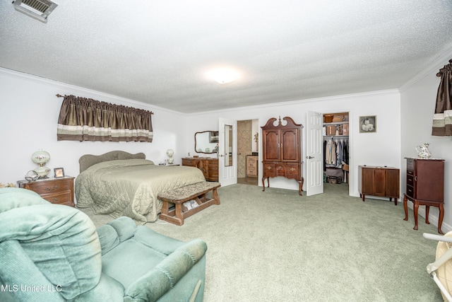 10001 Echo Glen Dr, Moss Point, MS 39562 - bedroom with crown molding, a walk in closet, light colored carpet, a textured ceiling, and a closet