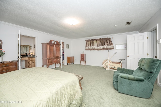10001 Echo Glen Dr, Moss Point, MS 39562 - bedroom featuring ornamental molding, carpet flooring, a textured ceiling, and ensuite bath