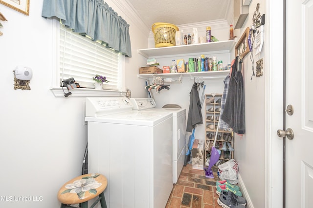 10001 Echo Glen Dr, Moss Point, MS 39562 - laundry area featuring washing machine and dryer, brick floors, ornamental molding, and a textured ceiling