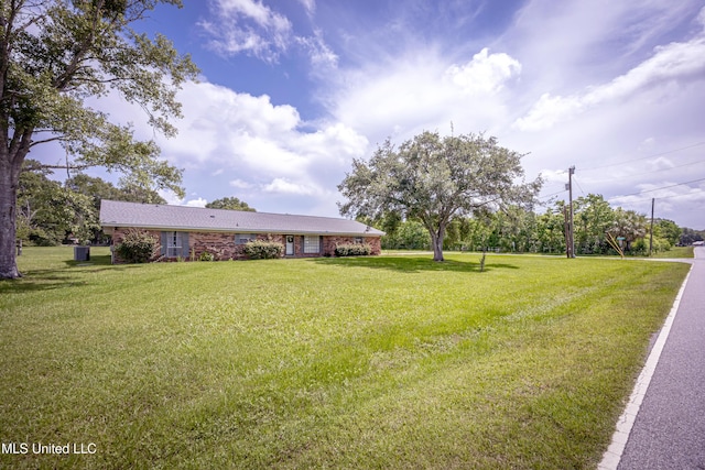 10001 Echo Glen Dr, Moss Point, MS 39562 - view of front of home with a front yard and brick siding