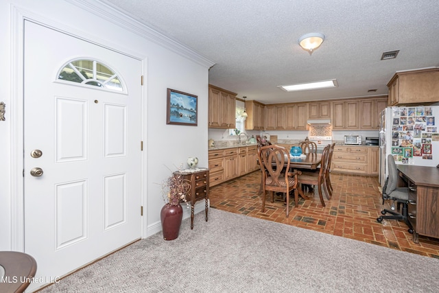 10001 Echo Glen Dr, Moss Point, MS 39562 - dining room with crown molding, a textured ceiling, and brick patterned flooring