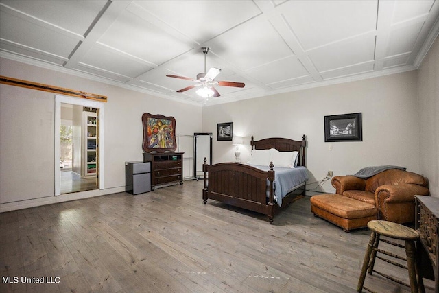 bedroom with hardwood / wood-style flooring, crown molding, ceiling fan, coffered ceiling, and baseboards
