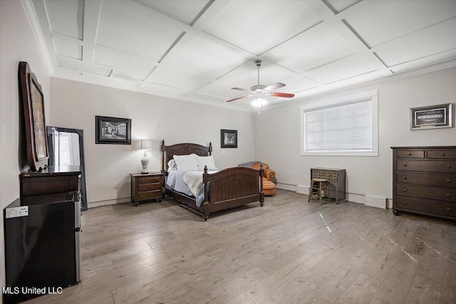 bedroom featuring coffered ceiling, baseboards, ceiling fan, crown molding, and light wood-type flooring