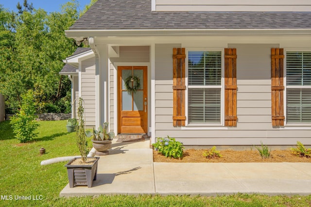 13 High Hills Dr, Hattiesburg, MS 39402 - entrance to property featuring a lawn, a shingled roof, and covered porch