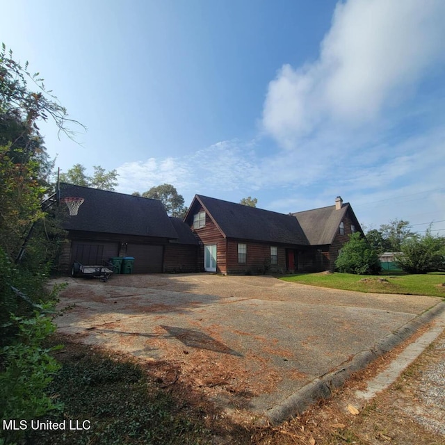 view of front of property with a garage