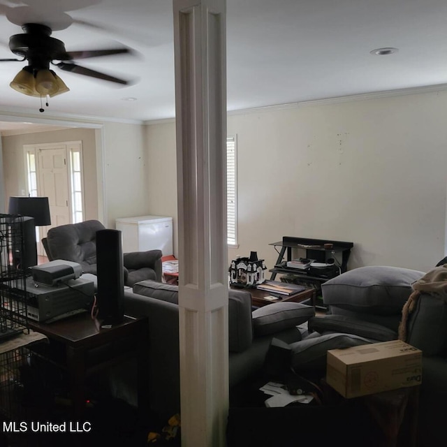 living room with ceiling fan, crown molding, and a wealth of natural light