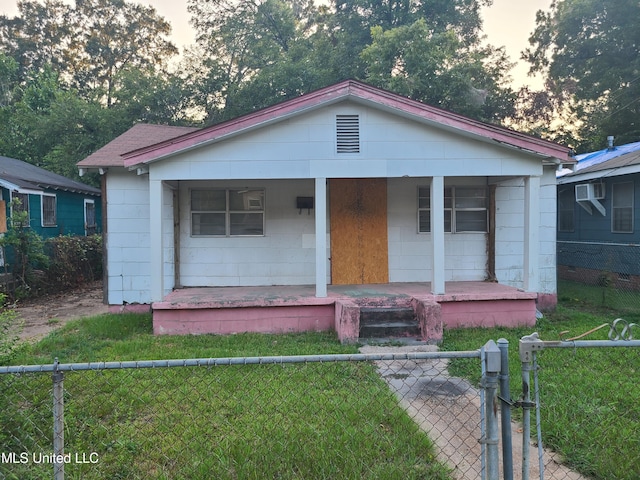 bungalow-style house featuring a yard and a porch