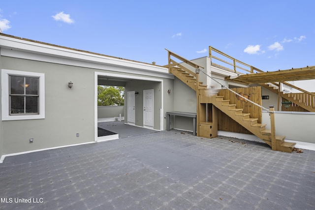 80 E Beach St Unit 4, Gulfport, MS 39507 - view of patio / terrace featuring stairs