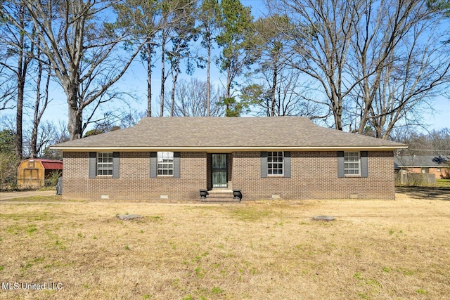 310 Lafayette St, Senatobia, MS 38668 - view of front facade with roof with shingles, brick siding, crawl space, and a front yard