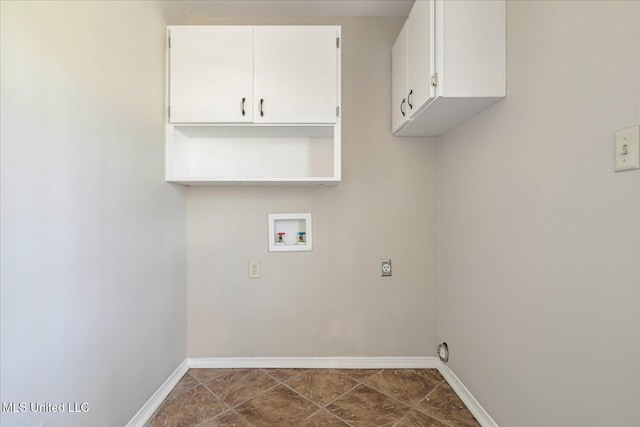 310 Lafayette St, Senatobia, MS 38668 - laundry room featuring washer hookup, cabinet space, hookup for an electric dryer, and baseboards