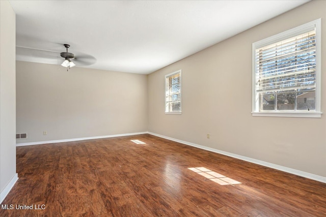 310 Lafayette St, Senatobia, MS 38668 - empty room featuring visible vents, ceiling fan, baseboards, and wood finished floors