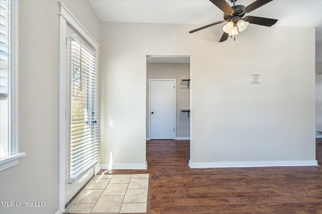 310 Lafayette St, Senatobia, MS 38668 - empty room featuring ceiling fan, light wood-style floors, and baseboards