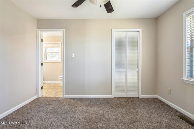 310 Lafayette St, Senatobia, MS 38668 - unfurnished bedroom with carpet, multiple windows, visible vents, and a closet