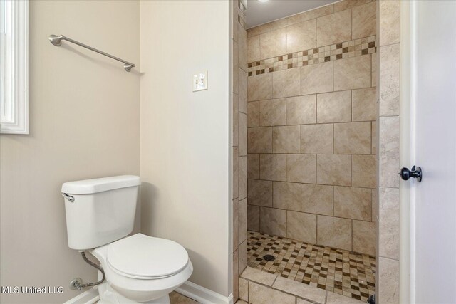310 Lafayette St, Senatobia, MS 38668 - bathroom with tiled shower and toilet