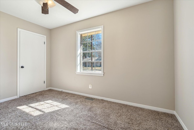 310 Lafayette St, Senatobia, MS 38668 - spare room with carpet floors, visible vents, baseboards, and a ceiling fan
