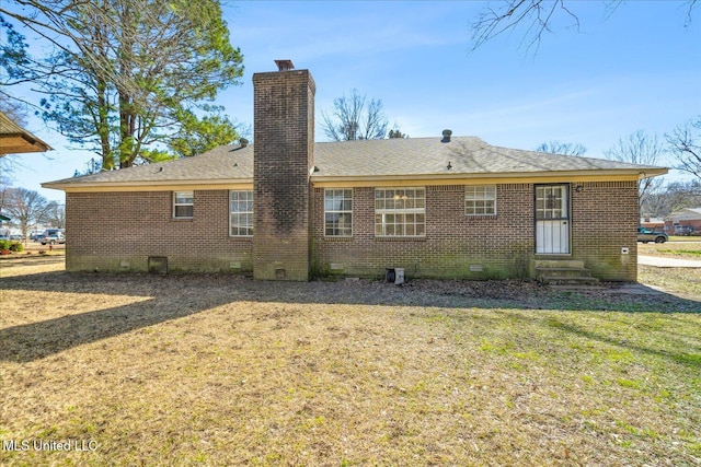 310 Lafayette St, Senatobia, MS 38668 - back of property featuring entry steps, a lawn, a chimney, crawl space, and brick siding