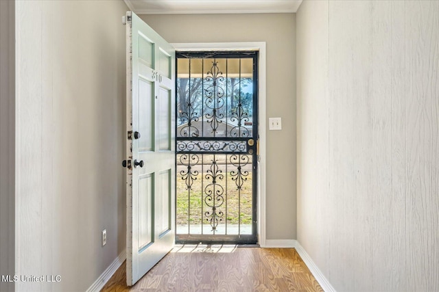 310 Lafayette St, Senatobia, MS 38668 - doorway featuring baseboards and wood finished floors