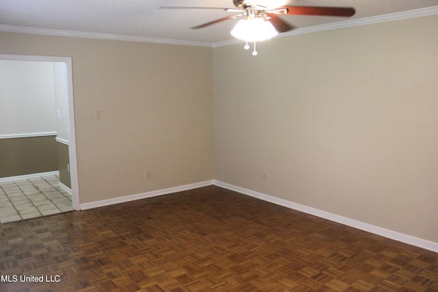 spare room featuring a ceiling fan, baseboards, and ornamental molding