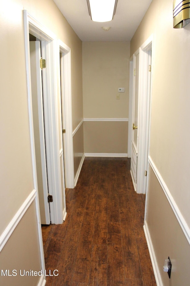 corridor featuring wood finished floors