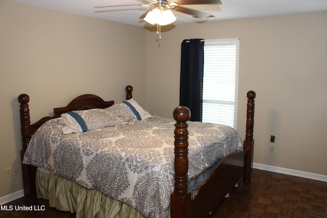 bedroom with baseboards and a ceiling fan