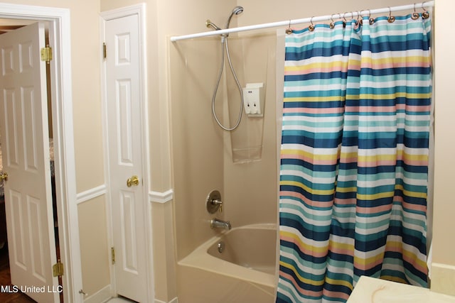 full bathroom featuring shower / bath combination with curtain