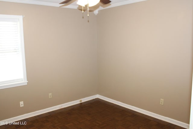 unfurnished room featuring a ceiling fan, baseboards, and crown molding