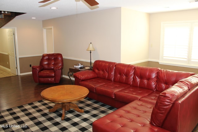 living room featuring visible vents, baseboards, recessed lighting, wood finished floors, and ceiling fan