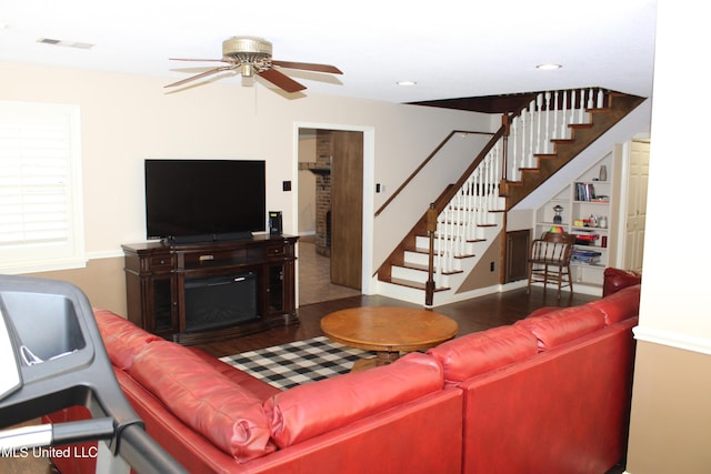 living area with visible vents, recessed lighting, wood finished floors, stairs, and ceiling fan