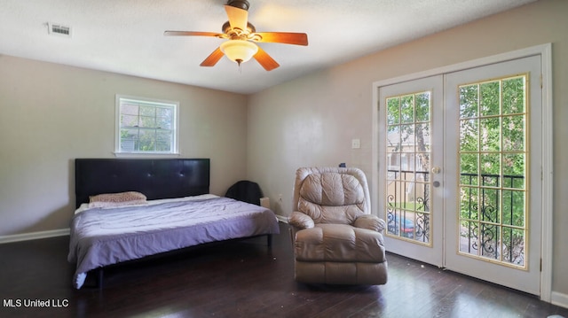 bedroom with dark hardwood / wood-style flooring, access to outside, french doors, and ceiling fan